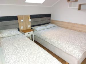 Posteľ alebo postele v izbe v ubytovaní Słoneczne Apartamenty w Poddąbiu