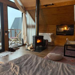 En eller flere senge i et værelse på Cottage Toladi