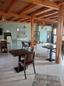 a dining room with tables and chairs in a room at Casa Medina Sanaa in Tétouan +39 photos