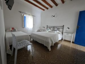Postel nebo postele na pokoji v ubytování Hotel Rodà