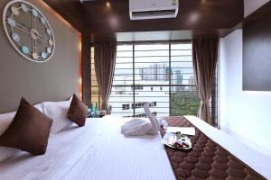Ένα ή περισσότερα κρεβάτια σε δωμάτιο στο Corporate Apartment - Gagal Home +92 φωτογραφίες