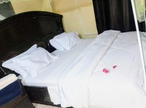 Postel nebo postele na pokoji v ubytování Ununio Beach Holiday Home