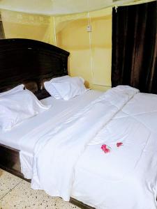 Postel nebo postele na pokoji v ubytování Ununio Beach Holiday Home