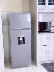 Kuchyň nebo kuchyňský kout v ubytování Bliss Ville Homes Buziga