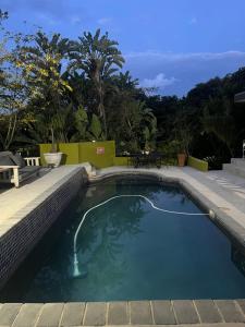 a swimming pool with a view of the ocean at Koru Guesthouse in Pretoria