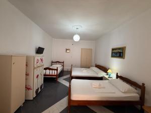 Postel nebo postele na pokoji v ubytování GuestHouse NOVI