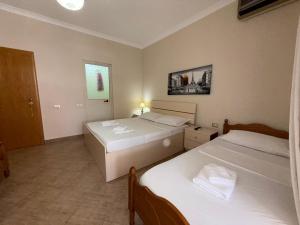 Postel nebo postele na pokoji v ubytování GuestHouse NOVI