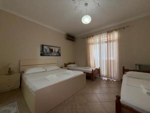 Postel nebo postele na pokoji v ubytování GuestHouse NOVI