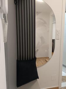 a black radiator in a room with a mirror at Apartman Boutique in Sarajevo +10 photos
