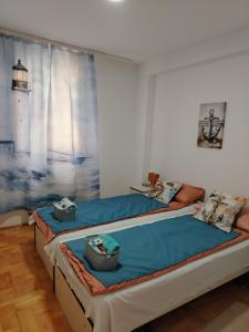 Postel nebo postele na pokoji v ubytování Apartman Domina