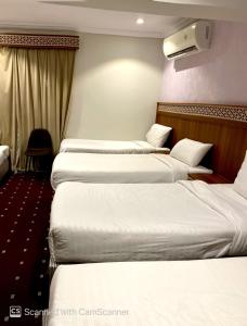 Voodi või voodid majutusasutuse فندق مواسم الخير الدولية toas