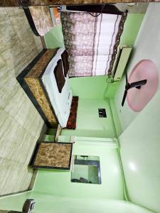 an overhead view of a room with a sink and a mirror at Sai Lodge in Parbhani