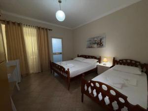 Postel nebo postele na pokoji v ubytování GuestHouse NOVI