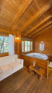 a large room with a large tub in a cabin at פסגת מתת Pisgat mattat in Mattat +59 photos
