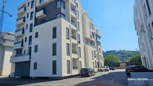 a tall building on the side of a street at Sublime nr9 in Ulcinj