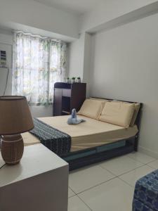 Una cama o camas en una habitación de Nice 1 BR, Horizon 101, Cebu City