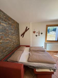 Postel nebo postele na pokoji v ubytování Appartamenti Rì de Clama