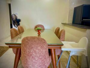 a meeting room with a table and chairs at Luxurious Beachfront Apartment in Alexandria