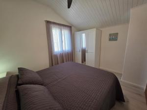 Postel nebo postele na pokoji v ubytování Lantana Apartment