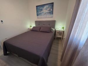 Postel nebo postele na pokoji v ubytování Lantana Apartment
