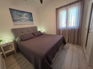 Postel nebo postele na pokoji v ubytování Lantana Apartment