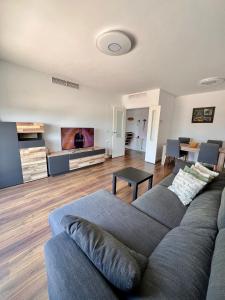 a living room with a couch and a table at Apartment in campello Beach in El Campello