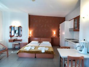 Postel nebo postele na pokoji v ubytování Elia Apartments