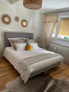 Postel nebo postele na pokoji v ubytování Appartement jerry et joy