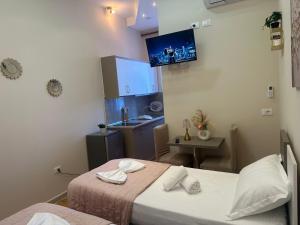 Postel nebo postele na pokoji v ubytování Hotel Osmani