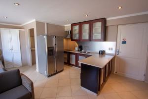 Kuchyň nebo kuchyňský kout v ubytování Luxury Studio Needlefish at Den Laman