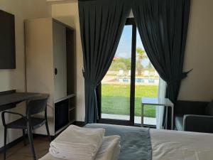 Postel nebo postele na pokoji v ubytování Kirykos Otel