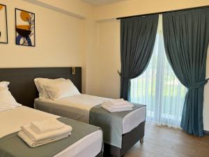 Postel nebo postele na pokoji v ubytování Kirykos Otel