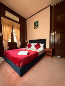 Ένα ή περισσότερα κρεβάτια σε δωμάτιο στο Nuruls Homestay +60 φωτογραφίες