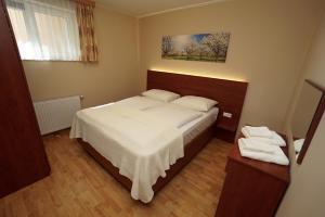 Postel nebo postele na pokoji v ubytování Appartement Alpensee
