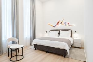 Postel nebo postele na pokoji v ubytování Hotel Eleven