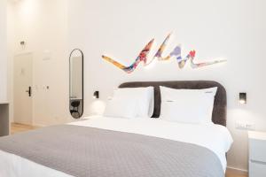 Letto o letti in una camera di Hotel Eleven