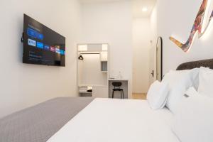 Letto o letti in una camera di Hotel Eleven