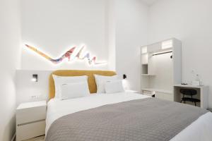 Letto o letti in una camera di Hotel Eleven