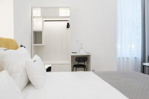 Letto o letti in una camera di Hotel Eleven