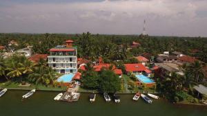 an aerial view of a resort with boats in the water at Ranga Holiday Resort in Bentota