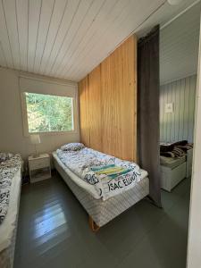 Ένα ή περισσότερα κρεβάτια σε δωμάτιο στο Saimaa lake cottage