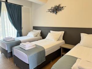 Postel nebo postele na pokoji v ubytování Kirykos Otel
