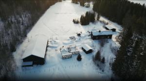 an aerial view of a house covered in snow at VitaNorse AB in Älglund