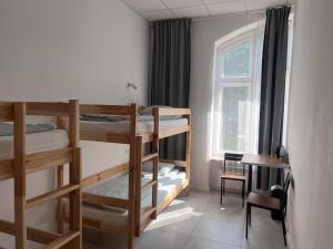 Postel nebo postele na pokoji v ubytování Golden Hostel