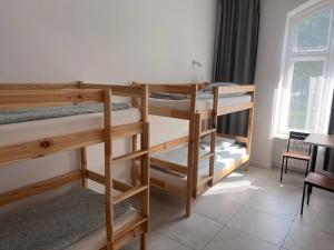 Postel nebo postele na pokoji v ubytování Golden Hostel