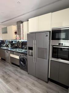 Kuchyň nebo kuchyňský kout v ubytování Comforts apartment 3