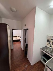 an empty room with a room with a bed in it at Sand and Waves House in Constanţa