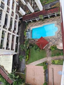 an overhead view of a pool and a building at Condominium 7th in Cebu City +13 photos