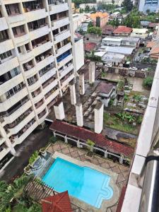 an overhead view of a pool in a city with tall buildings at Condominium 7th in Cebu City