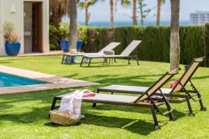 The swimming pool at or close to Ocean Views Luxury Villa next to beach